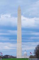 Washington Monument with The United States Capitol on a cloudy blue sky day, Washington DC, USA