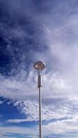 Internet, WiFi tower against the background of a bright blue cloudy sky. Technologies