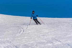 Grandvalira, Andorra . 2021 december 11 Young woman skiing in the Pyrenees at the Grandvalira ski resort in Andorra in Covid19 time photo