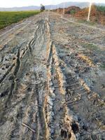 a broken country road. muddy road photo