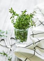 Close up view of thyme bunch. Green thyme in a glass