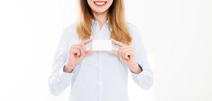 young woman in shirt holding business card isolated on a white background, female hand holding card. Business concept. Copy space photo