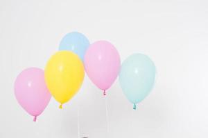 Colorful party balloons background. Isolated on white. Copy space photo