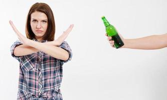 Lady refused alcohol drink isolated on white background. Anti-alcohol concept. Copy space isolated photo