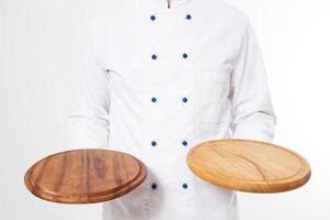 male cook holding two empty pizza boards isolated on white background, blank photo