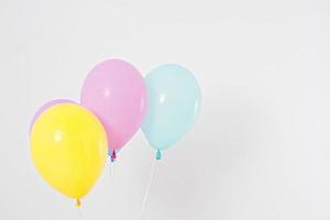 Colorful party balloons background. Isolated on white. Copy space photo