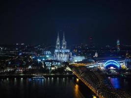 Aerial night view of St Peter Cathedral and Hohenzollern Bridge photo