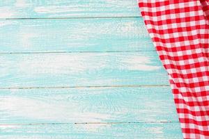 top view empty wooden table and checkered tablecloth photo