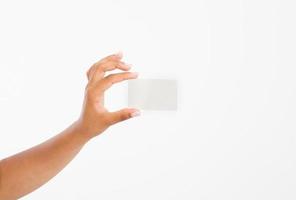 hand hold blank business card. female arm hold paper isolated on white background. copy space. mock up. photo