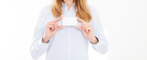 young woman in shirt holding business card isolated on a white background, female hand holding card. Business concept. Copy space photo