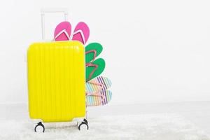 suitcase isolated on white background Summer holidays. summer flip flops or slippers.Sandals beach.Red cap.Travel valise or bag. Mock up. Copy space. Template. Blank. photo