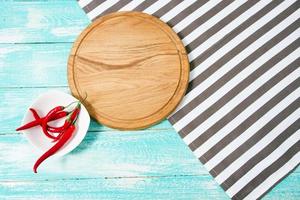 Top view striped tablecloth and plank on wooden table,hot pepper, mock up photo