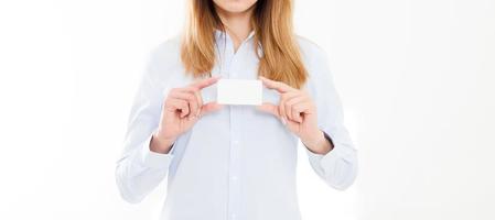 young woman in shirt holding business card isolated on a white background, female hand holding card. Business concept. Copy space photo