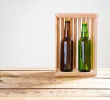Beer bottles on a wooden table . Top view. Selective focus. Mock up. Copy space.Template. Blank.