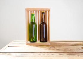Beer bottles on a wooden table . Top view. Selective focus. Mock up. Copy space.Template. Blank. photo