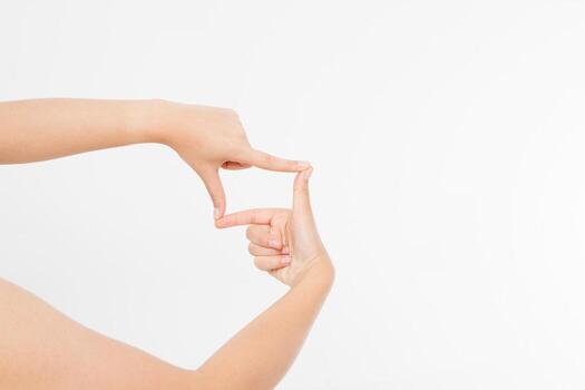 Female hands framing comosition. Isolated on white background. Copy space. Mock up. photo