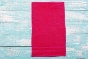 Red soft towel on wooden background mockup copy space photo