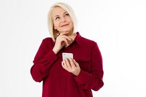 Middle-aged woman hold phone, middle age beautiful woman chatting with someone and holding a smartphone over white photo