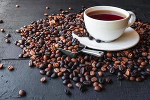 Cup of coffee and Roasted coffee beans photo