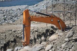 excavator digging a hole photo