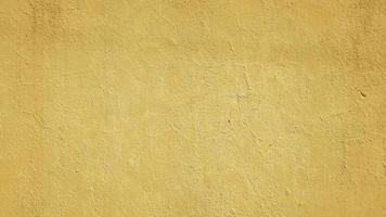 Fondo de textura de pared de hormigón abstracto pintado amarillo foto