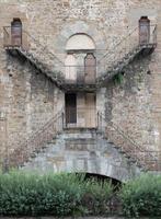 Exterior detail of antique building in Florence, Italy, with Escher architecture style. photo