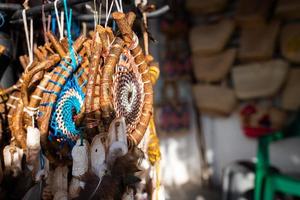 Hanging decorative artifacts for sale in souvenir shop photo