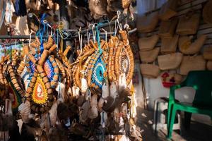 Hanging decorative artifacts for sale in souvenir shop photo