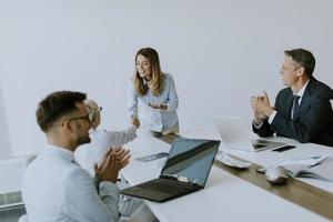 Young business partner explaining project details on a meeting in office photo