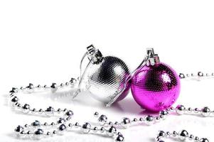 Christmas balls with ornaments on white background. photo