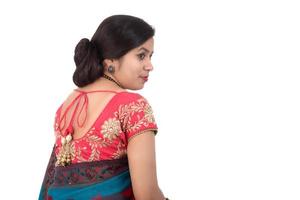 Beautiful young girl posing in Indian traditional saree on white background. photo