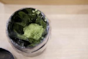 Green wasabi sauce or paste in box photo