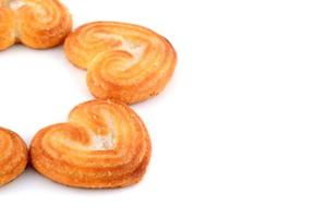 Heart shaped Biscuit cookies on white background photo