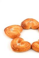 Heart shaped Biscuit cookies on white background photo