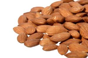 Tasty almonds nuts isolated on white background photo