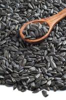 Sunflower Seeds, Helianthus annuus with Wooden Spoon photo