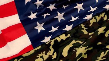 American flag and Military camouflage pattern. Top view angle. photo