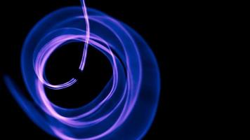 Glowing abstract curved blue and magenta lines - Light painted 4K video timelapse