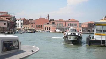 Venice streets and canals. Ships are sailing on the water in Summer video