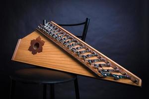 Russian folk musical instruments. Gusli isolated on a black background photo