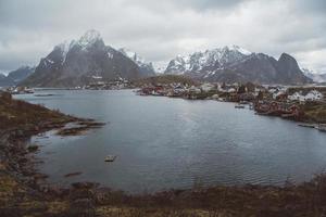 Norway rorbu houses and mountains rocks over fjord landscape scandinavian travel view Lofoten islands. Natural scandinavian landscape. photo