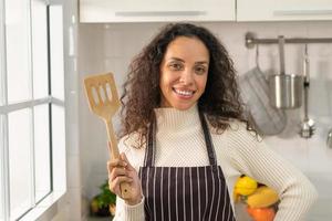 portrait Latin woman in kitchen photo