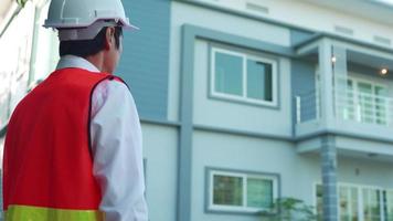 Engineer and construction concept. Inspector engineer is inspecting the house with reference to the construction standards. Engineers are doing final checks before delivering to clients. video