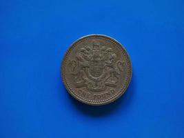 One Pound GBP coin, United Kingdom UK over blue photo