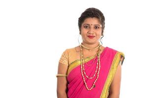 Close up of Beautiful Indian Traditional young girl in saree on white background photo