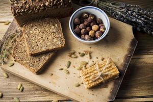 view fresh organic bread with ingredients energy bar chopping board photo