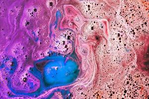 red pink blue bathbomb dissolve water photo