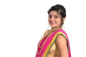 Close up of Beautiful Indian Traditional young girl in saree on white background photo