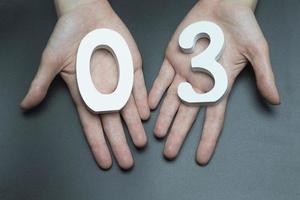 On the palms of the figure three and zero. photo