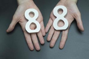 To female hands the figure of eighty-eight. photo